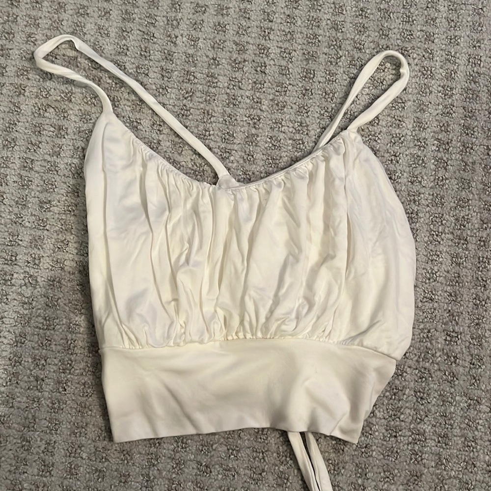 Diosa Top sold from Boujee. Size Medium white top that ties in the back.